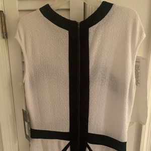 White and Black dress. Zips in the back